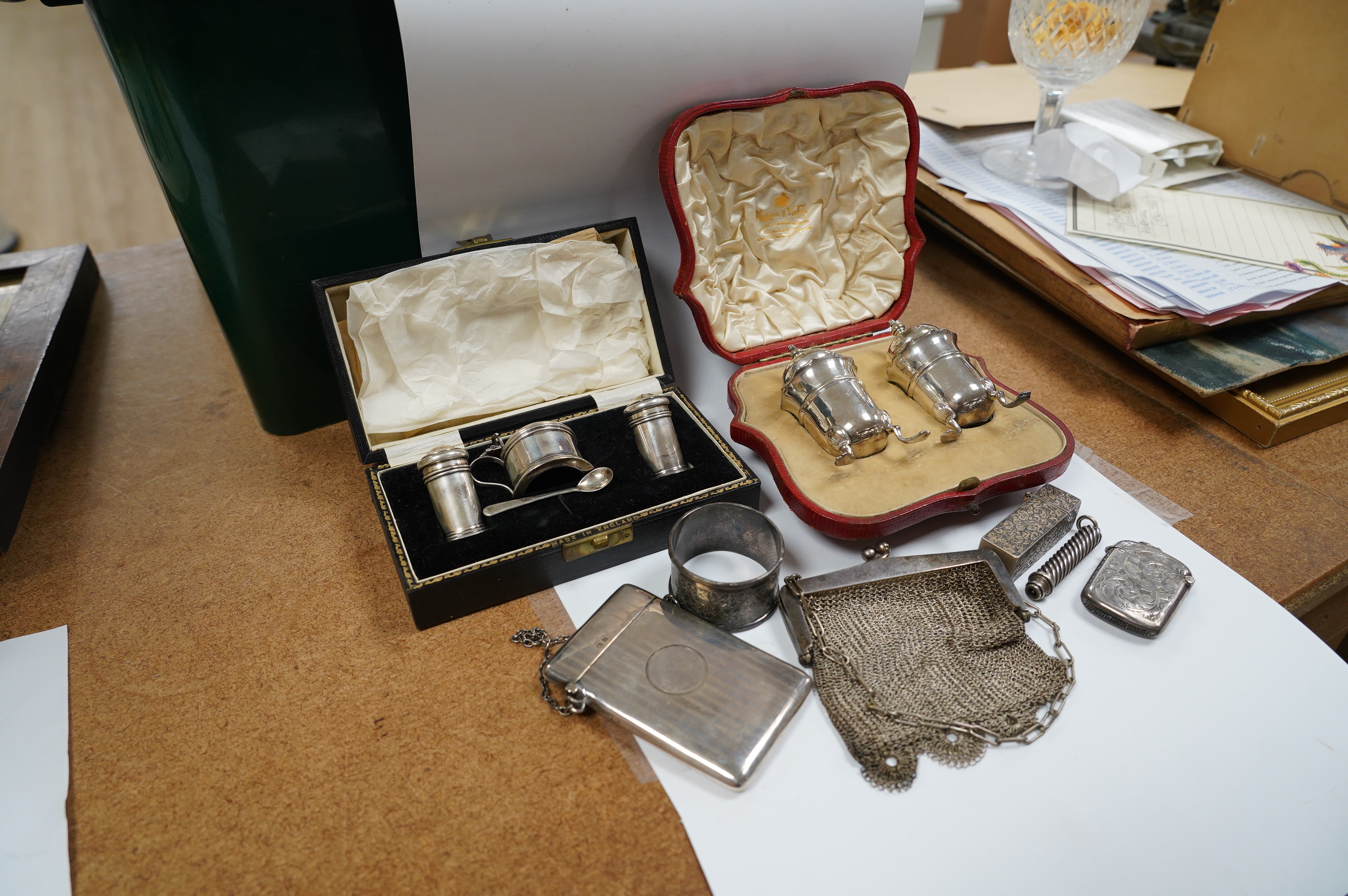 Sundry small silver including two cased condiment sets, a card case, vesta, scent flask, etc. and a plated evening bag. Condition - poor to fair